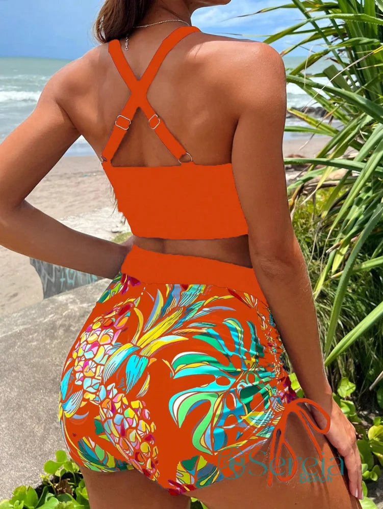 Biquíni com Top Esportivo e Short Floral Biquíni com Top Esportivo e Short Floral