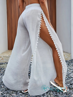 Saída de Praia Calça com Fendas Laterais e Pompons Saída de Praia Calça com Fendas Laterais e Pompons