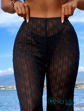 Saída de Praia Calça Flare em Tecido Transparente Saída de Praia Calça Flare em Tecido Transparente
